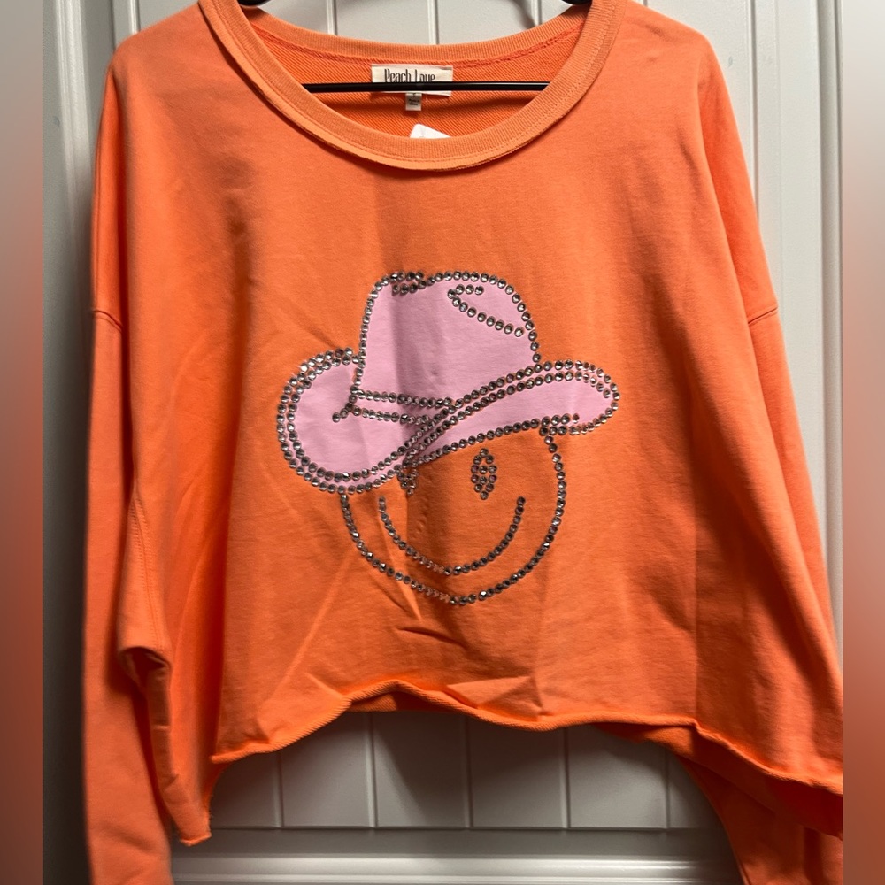 Orange cropped crewneck sweatshirt